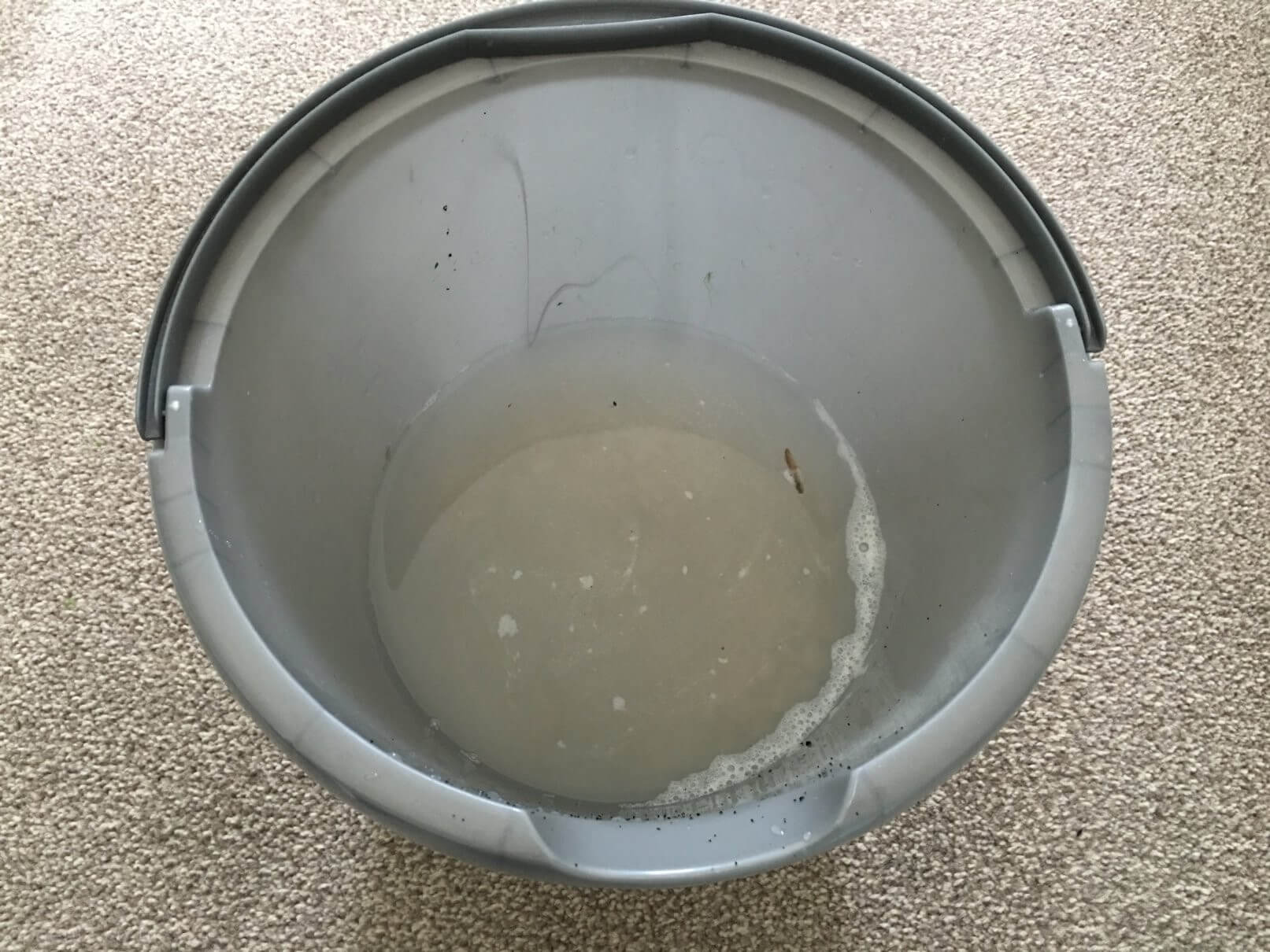 Washing the crushed coral substrate.